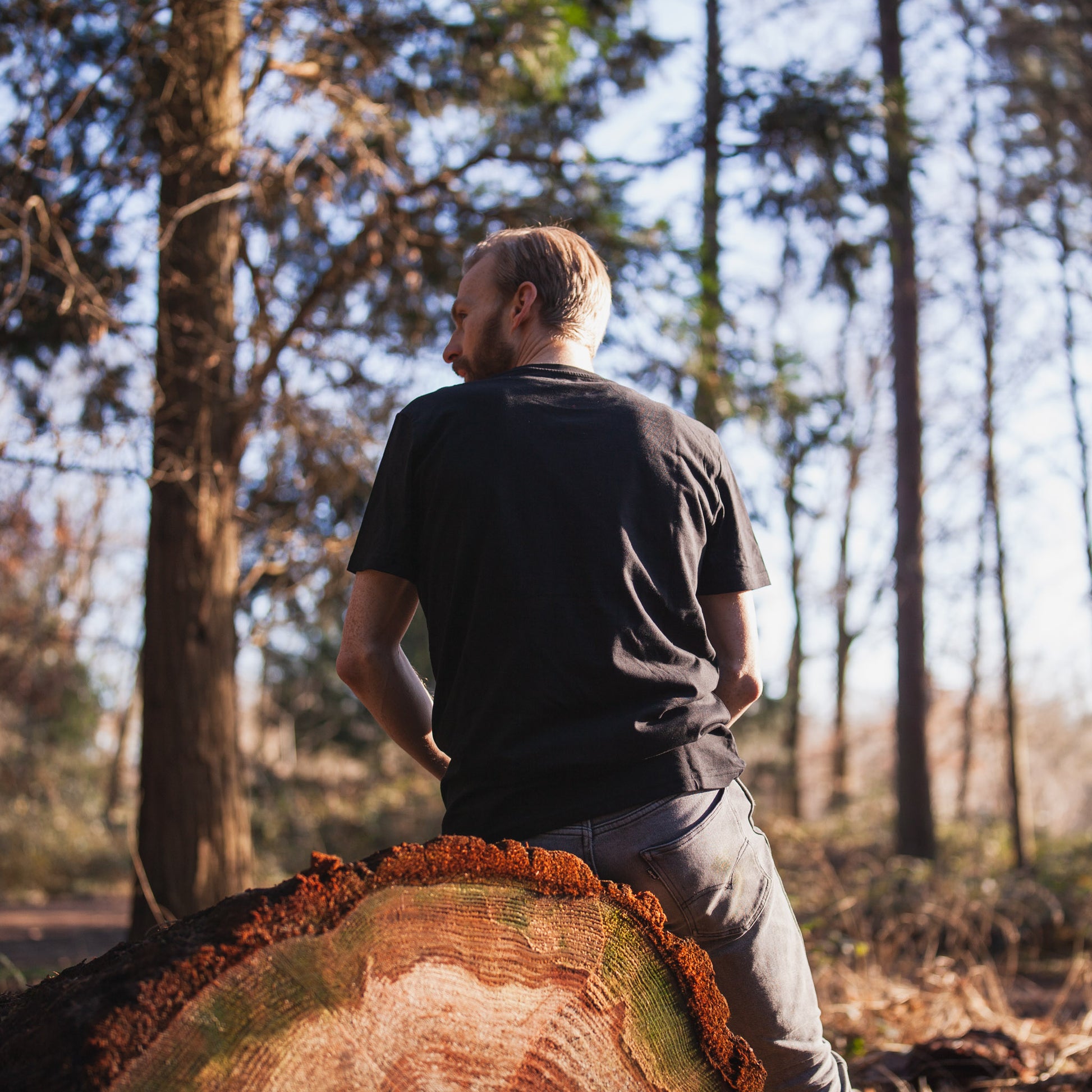 a man riding on the back of a brown bear 